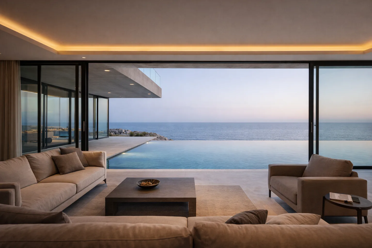 Minimalist living room looking outward through floor-to-ceiling glazing toward the infinity pool and sea horizon